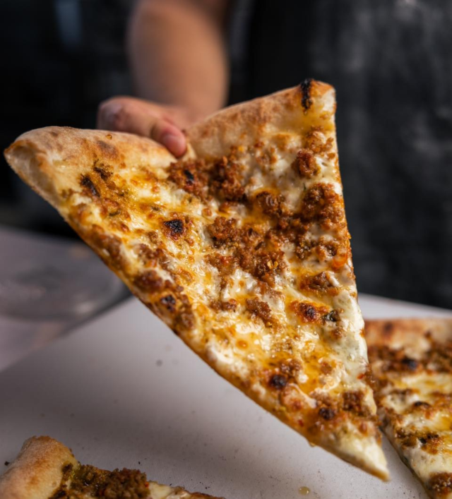 We serve slices ALL DAY and you can get them HALF OFF every Tuesday, Wednesday, and
Thursday from 2-4 P.M.
.
What’s the difference between the pizza here and at Pangea Kitchen? At Pangea Pizzeria,
we serve Neo-Neapolitan pizza. It’s an American adaptation using Italian techniques and it
results in crispier crust, more toppings, and a larger pie. Because of that, it’s perfect to eat
by the slice!
.
Choose from 5 slices each day, including 1 rotating slice and 1 Chef’s Choice. Our monthly
featured pizza is always offered as Chef’s Choice on Tuesdays and Fridays. See the menu
at tastepangeapizzeria.com.