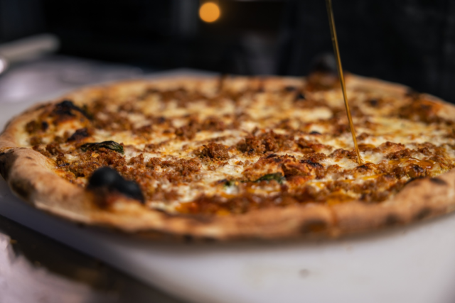 Our Pistachio pizza is a fan favorite and our best seller! Featuring unique toppings, like pureed pistachios and Italian sausage, with mozzarella and fresh basil, it's topped with our house-made Calabrian chili honey, which creates a perfect balance of salty, spicy, and sweet flavors!
.
🚙 Order pickup or delivery: tastepangeapizzeria.com Remember, orders of $50 or more receive FREE delivery!